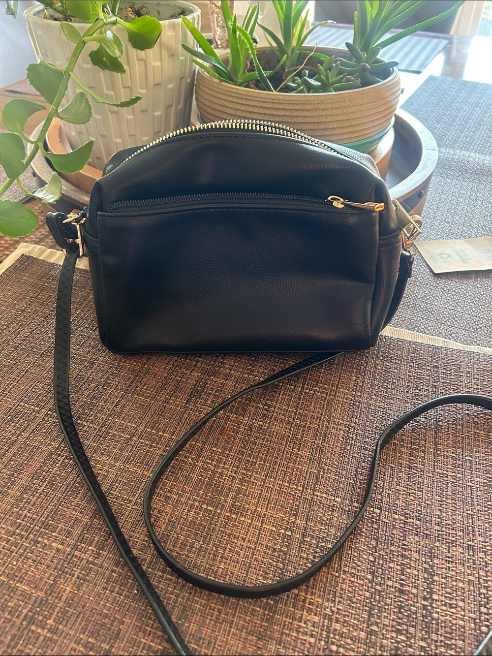 Minimalist Black Crossbody Bag with Gold Accents